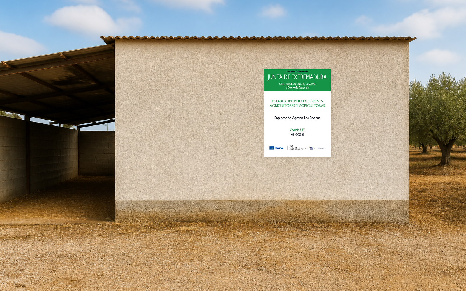 Cartel de Joven Agricultor de Extremadura instalado directamente en la pared frontal de una nave de una explotación agrícola.